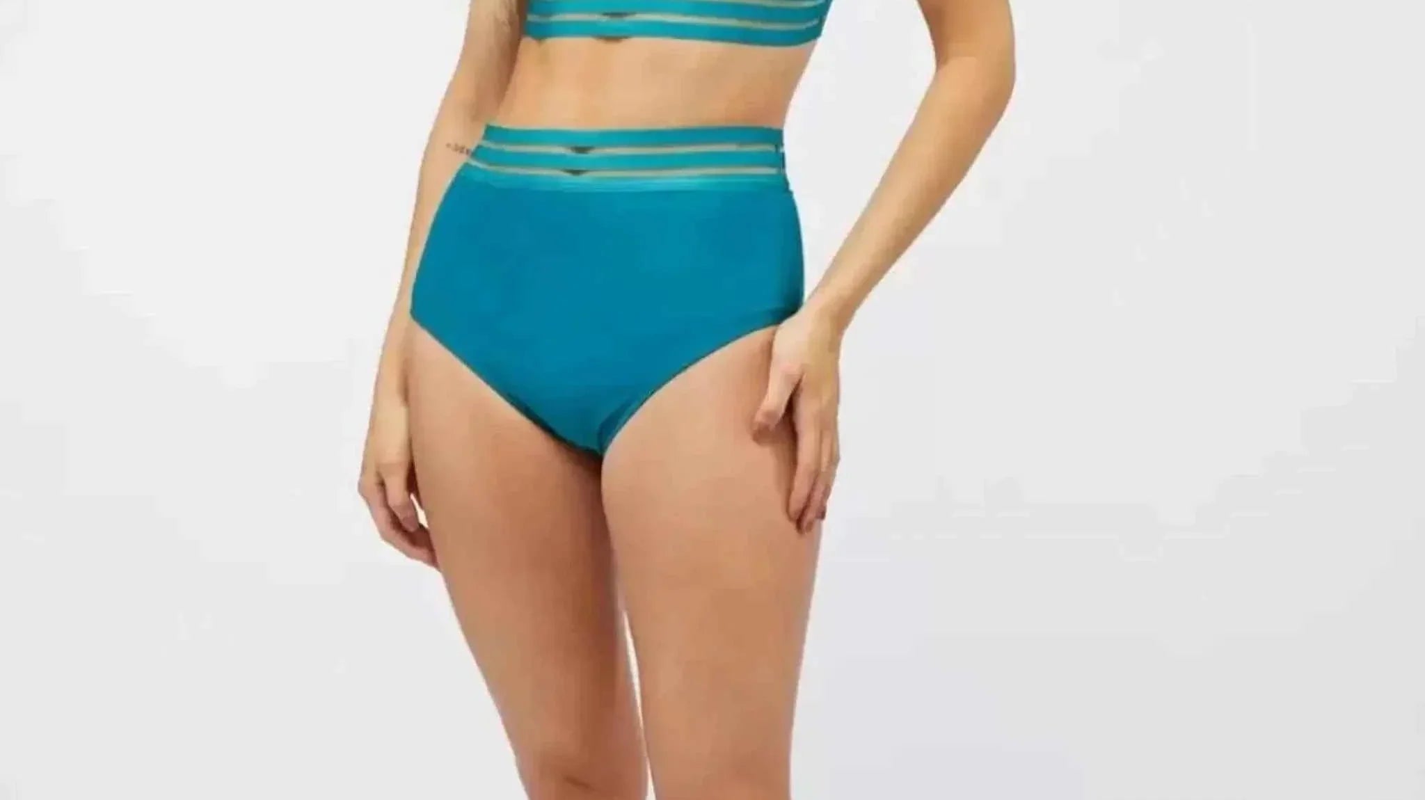 Plus size woman wearing a laced two piece swimsuit