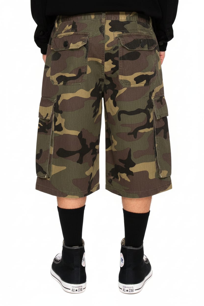 Camouflage cargo shorts worn by a person on a white background