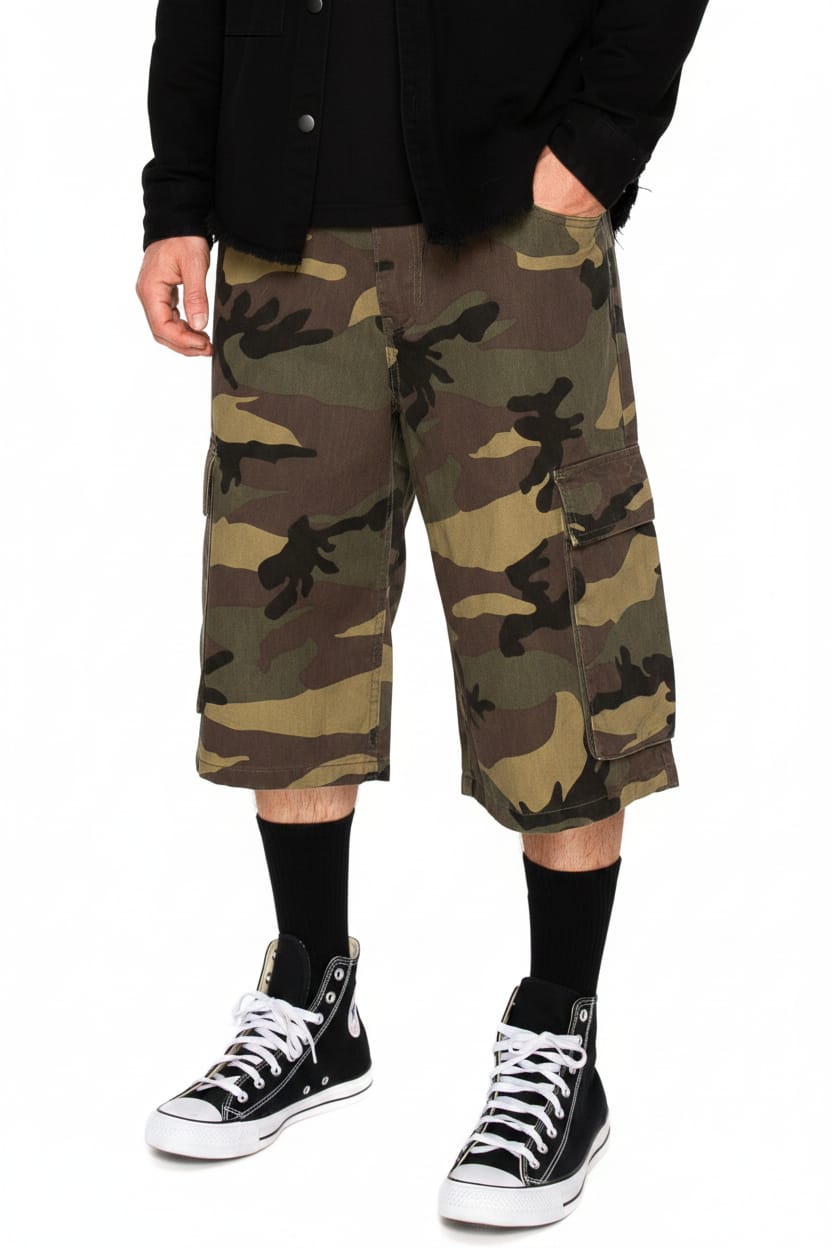 Camouflage cargo shorts worn with black high-top sneakers on a white background