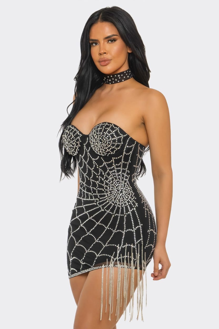 Model wearing the Champagne Royale Rhinestone Corset Mini Dress in black with crystal chain fringe hem and rhinestone choker