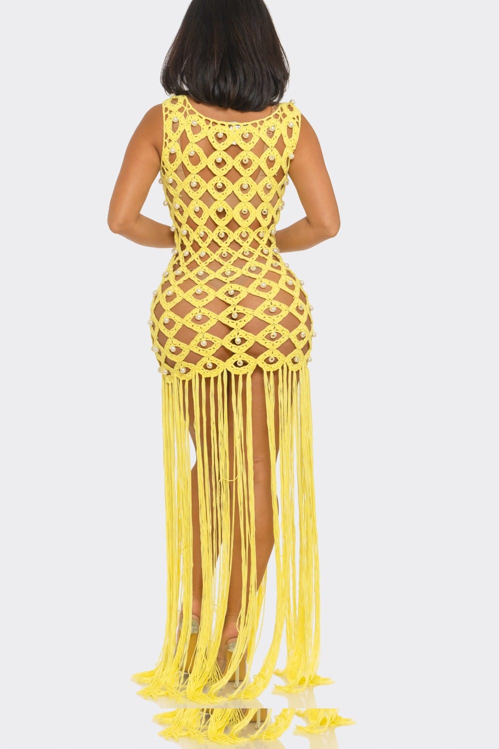 Yellow fringe dress on a white background