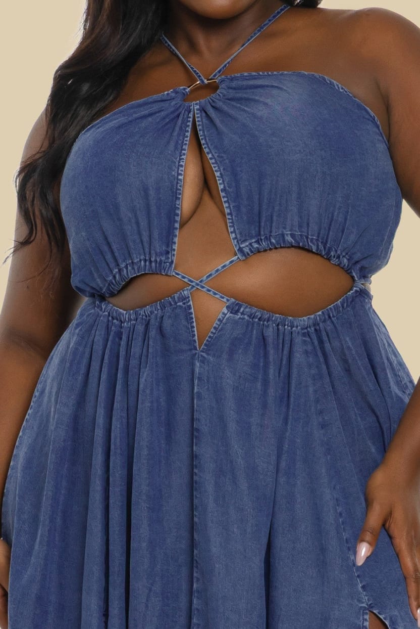 Blue denim dress with cut-out design on a beige background