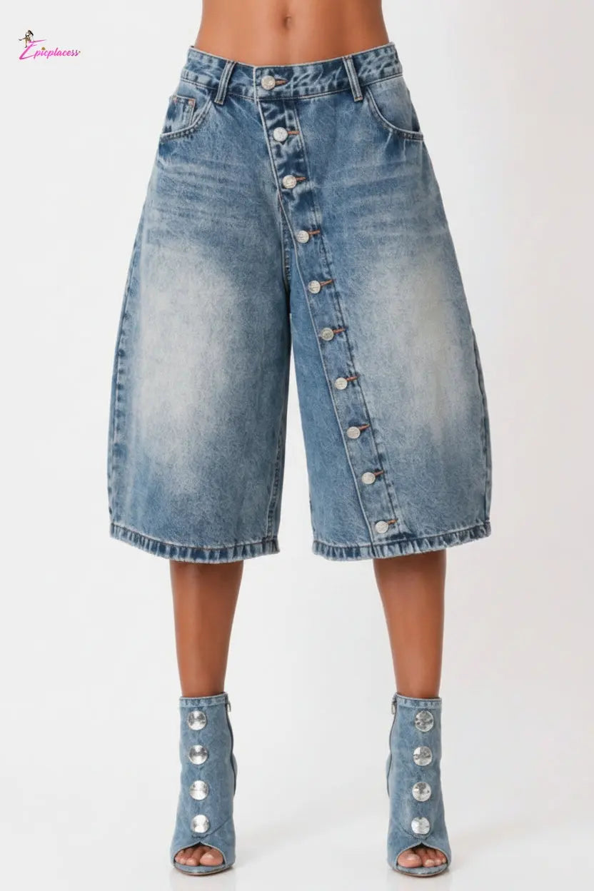 Denim skirt with button details on a white background