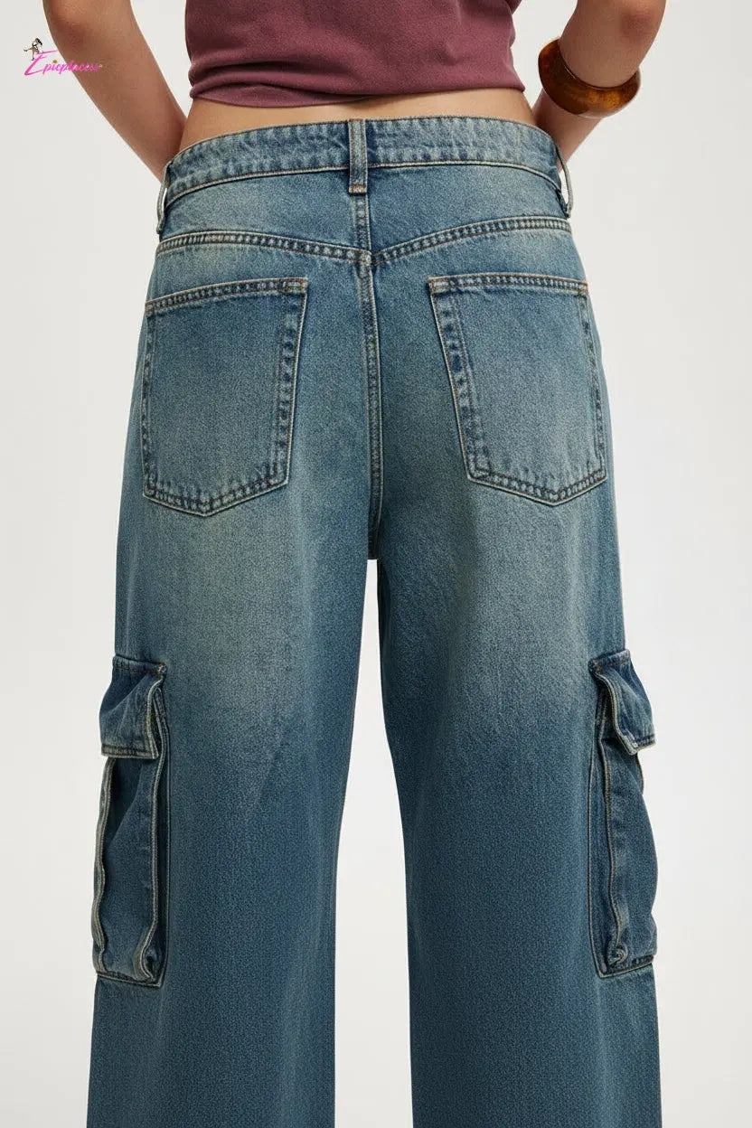 Blue jeans with cargo pockets on a plain background