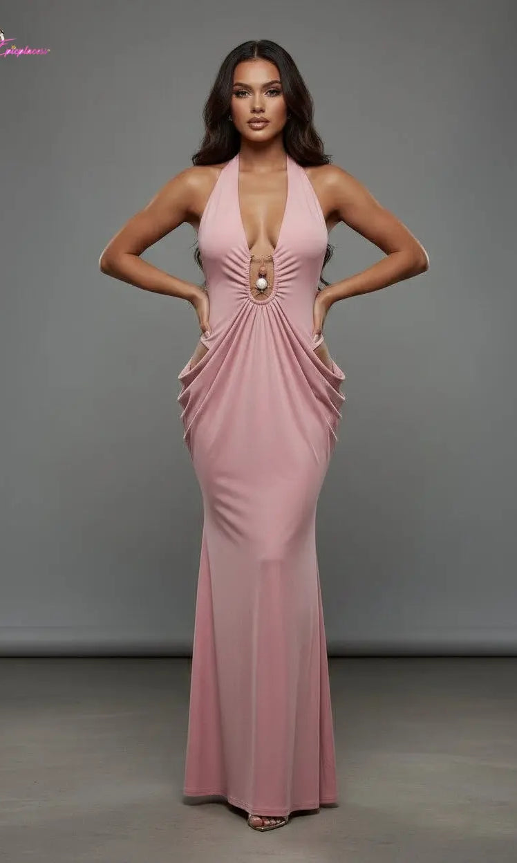 Woman wearing a pink evening gown against a gray background