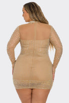 A woman shown from the back wearing a fitted, sheer long-sleeve mini dress covered in shimmering gold sequins and beads against a light gray studio background.