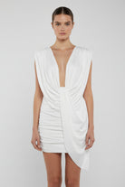 White dress with draped design on a mannequin against a white background