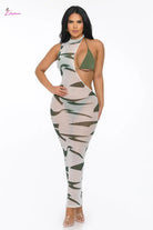 Woman wearing a camouflage dress on a white background