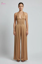 Brown jumpsuit on a mannequin against a plain background
