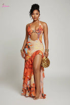 Orange abstract floral halter maxi dress - front model view