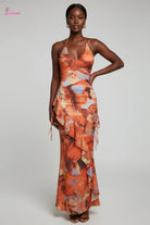 Orange abstract floral halter maxi dress - side view
