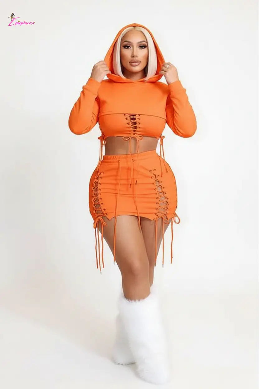 Neon orange lace-up crop top and mini skirt set - front with hood