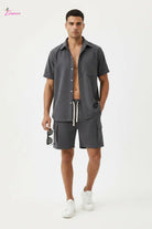 Men's charcoal grey short sleeve button-up cargo shorts set - front with sunglasses