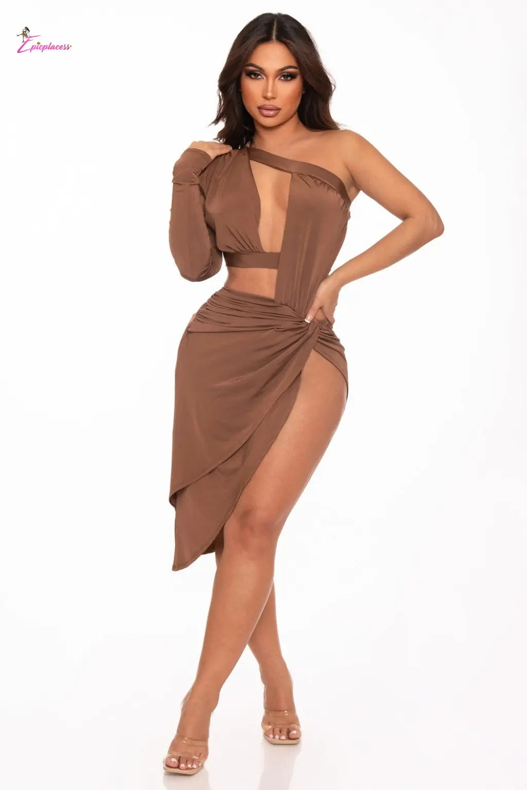 Woman wearing a brown dress with a high slit on a white background