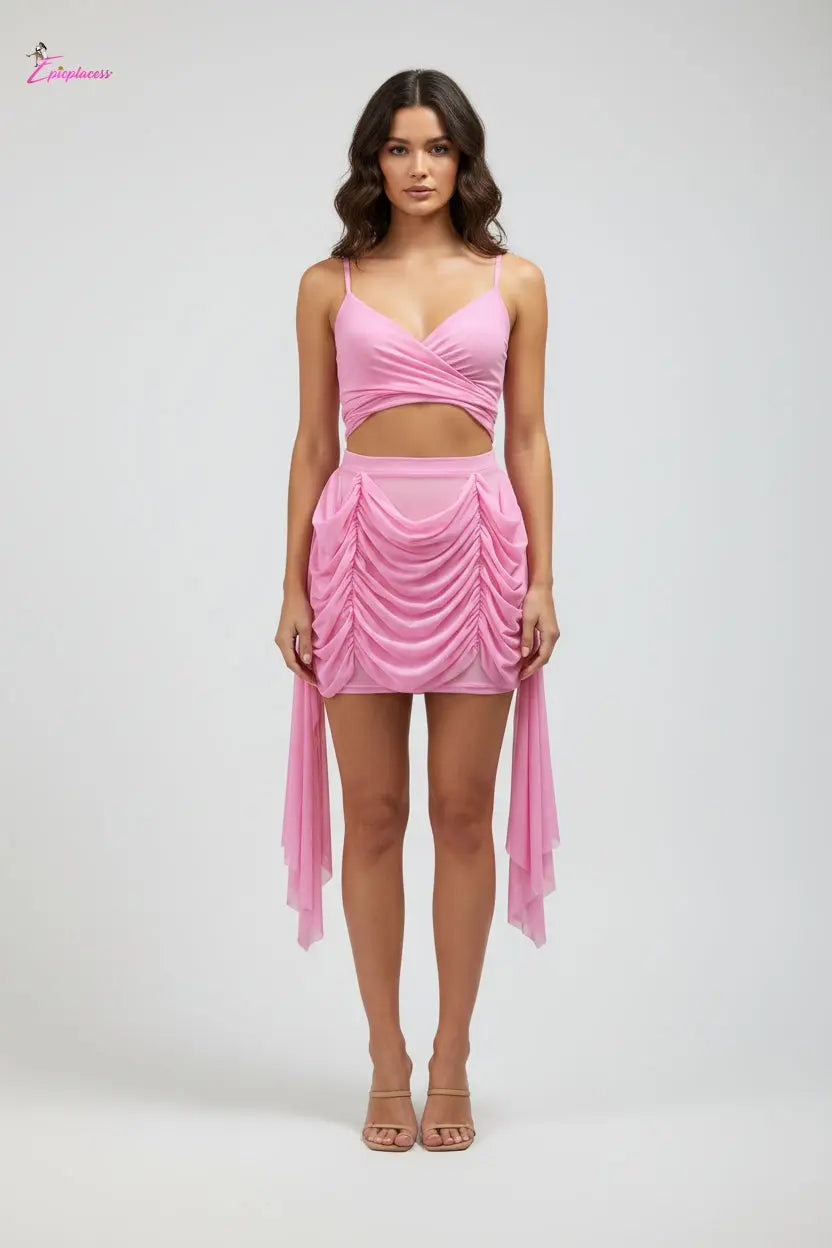 Pink dress on a mannequin against a white background