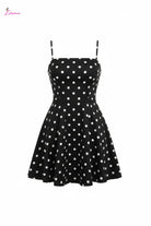 Studio professional photo of black polka dot spaghetti strap mini dress on white background