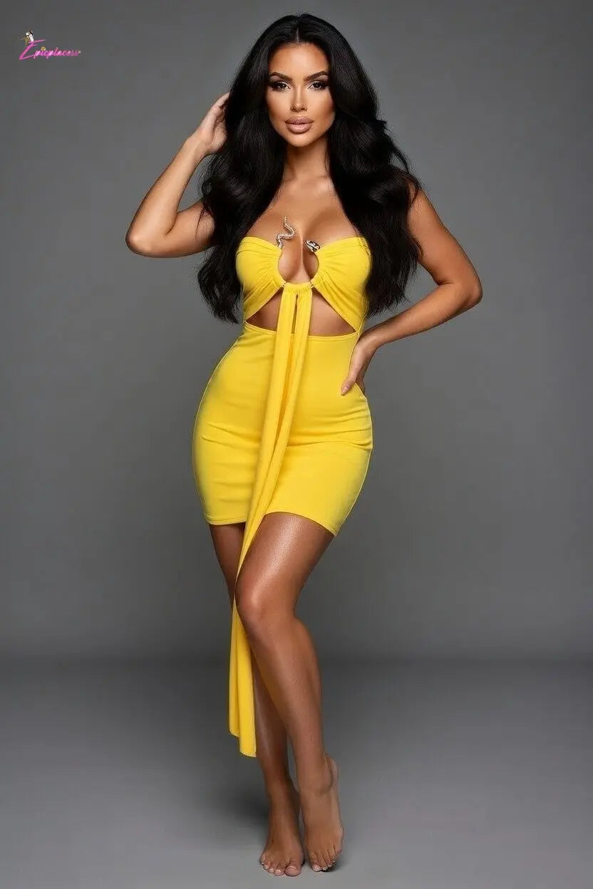 Woman wearing a yellow dress against a gray background