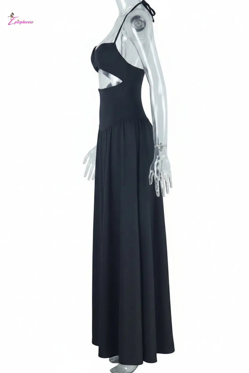 Black dress on a mannequin with a white background